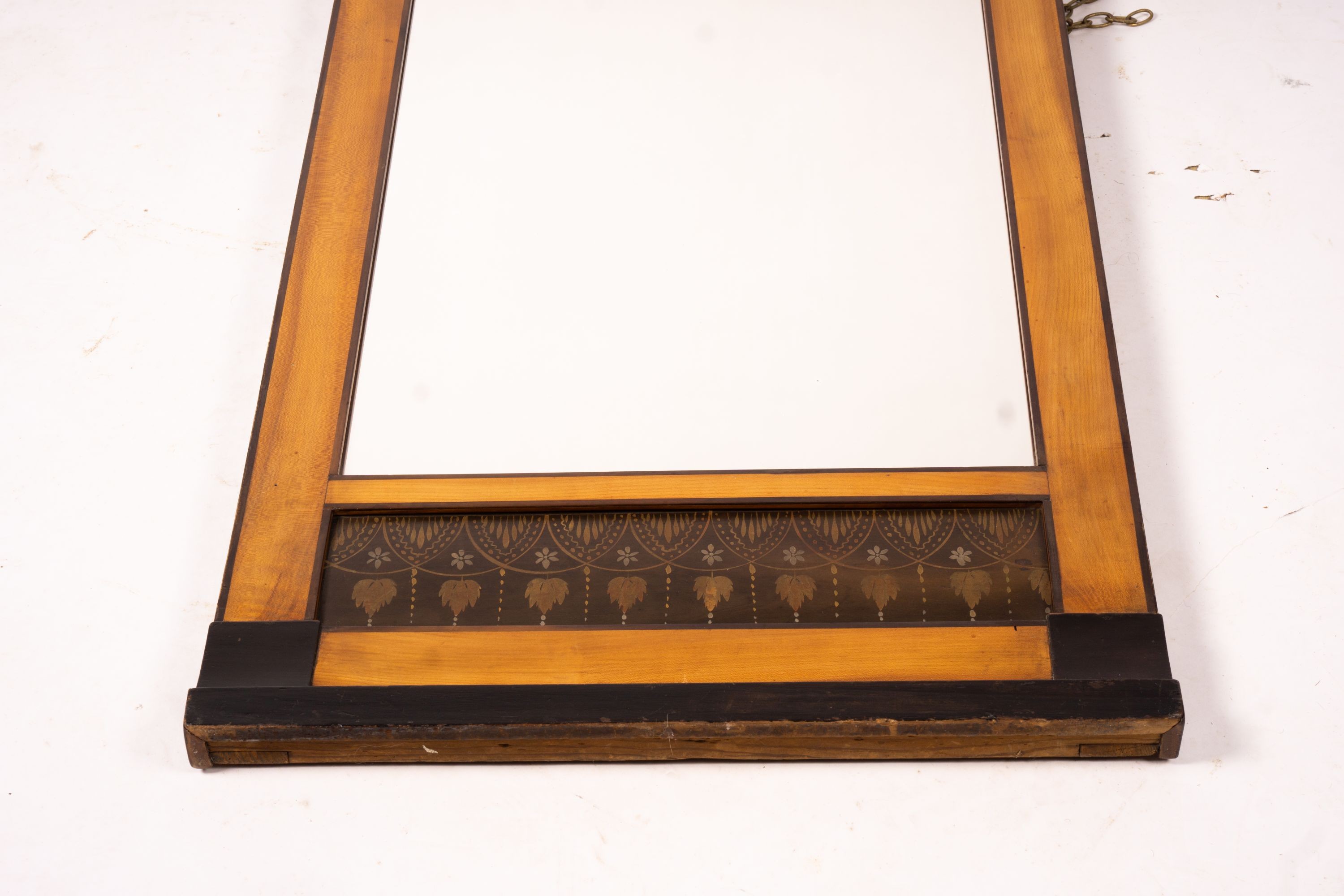 A Biedermeier style mirror with stencil decoration, width 51cm, height 109cm